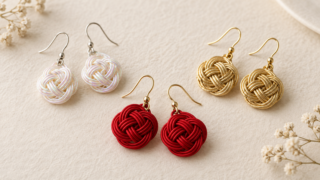 Handmade Mizuhiki earrings in matte red, iridescent pearl, and metallic gold