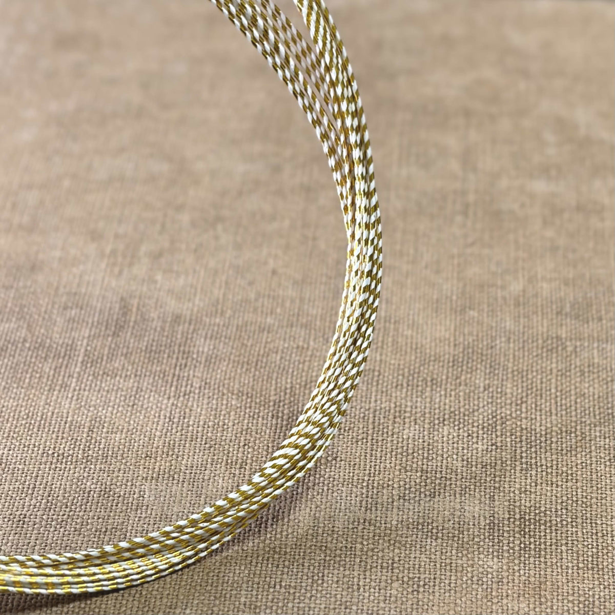 Spiral wrapped Japanese mizuhiki cord, gold spiral wrapped, image 1