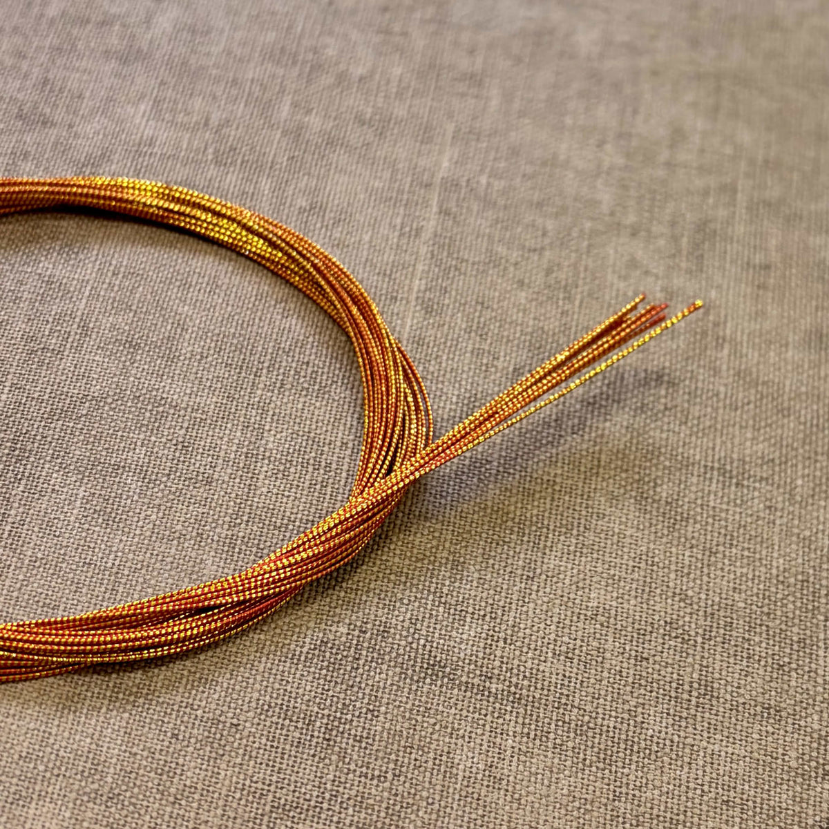 Spiral wrapped Japanese mizuhiki cord, red gild spiral wrapped, image 1