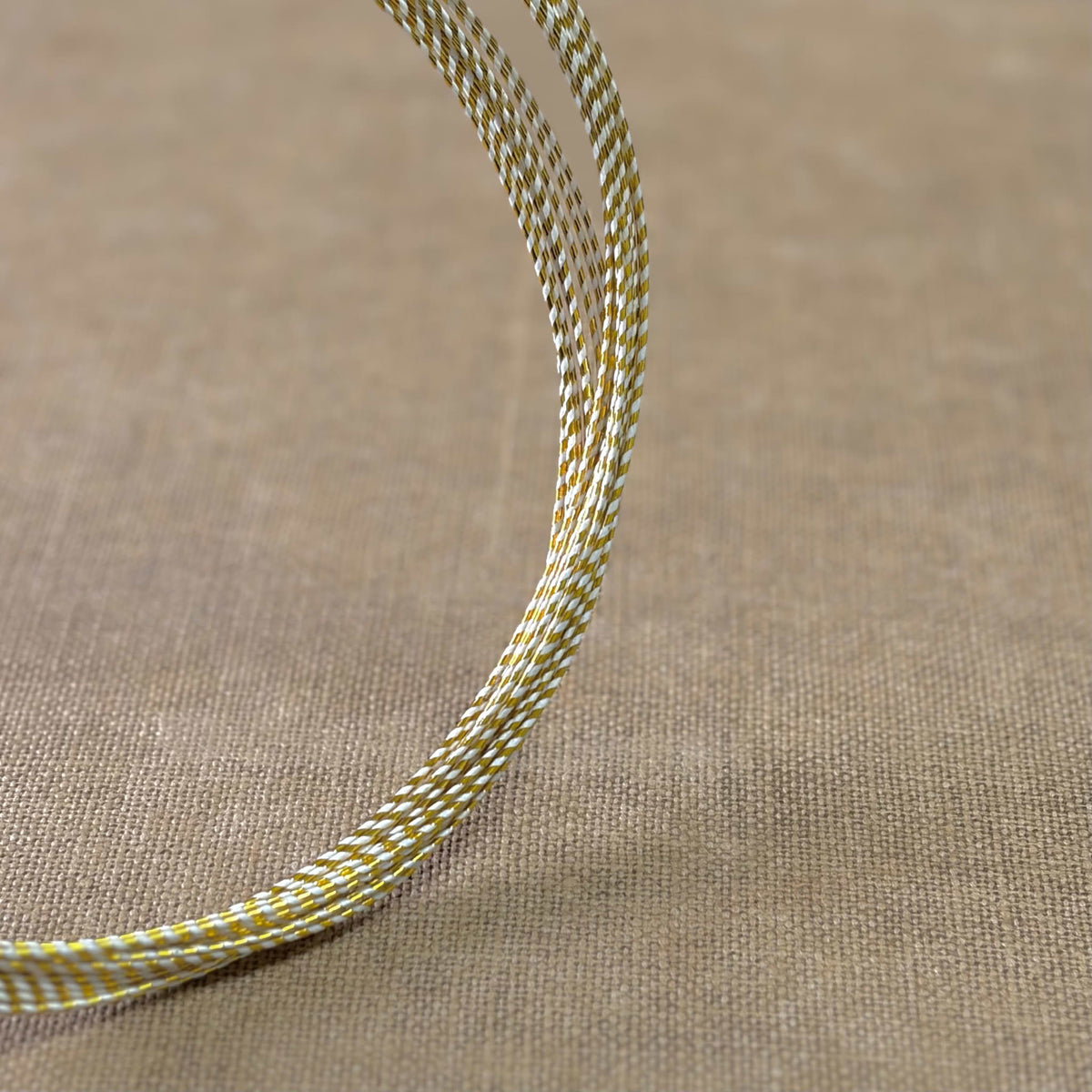 Spiral wrapped Japanese mizuhiki cord, gold spiral wrapped, image 2