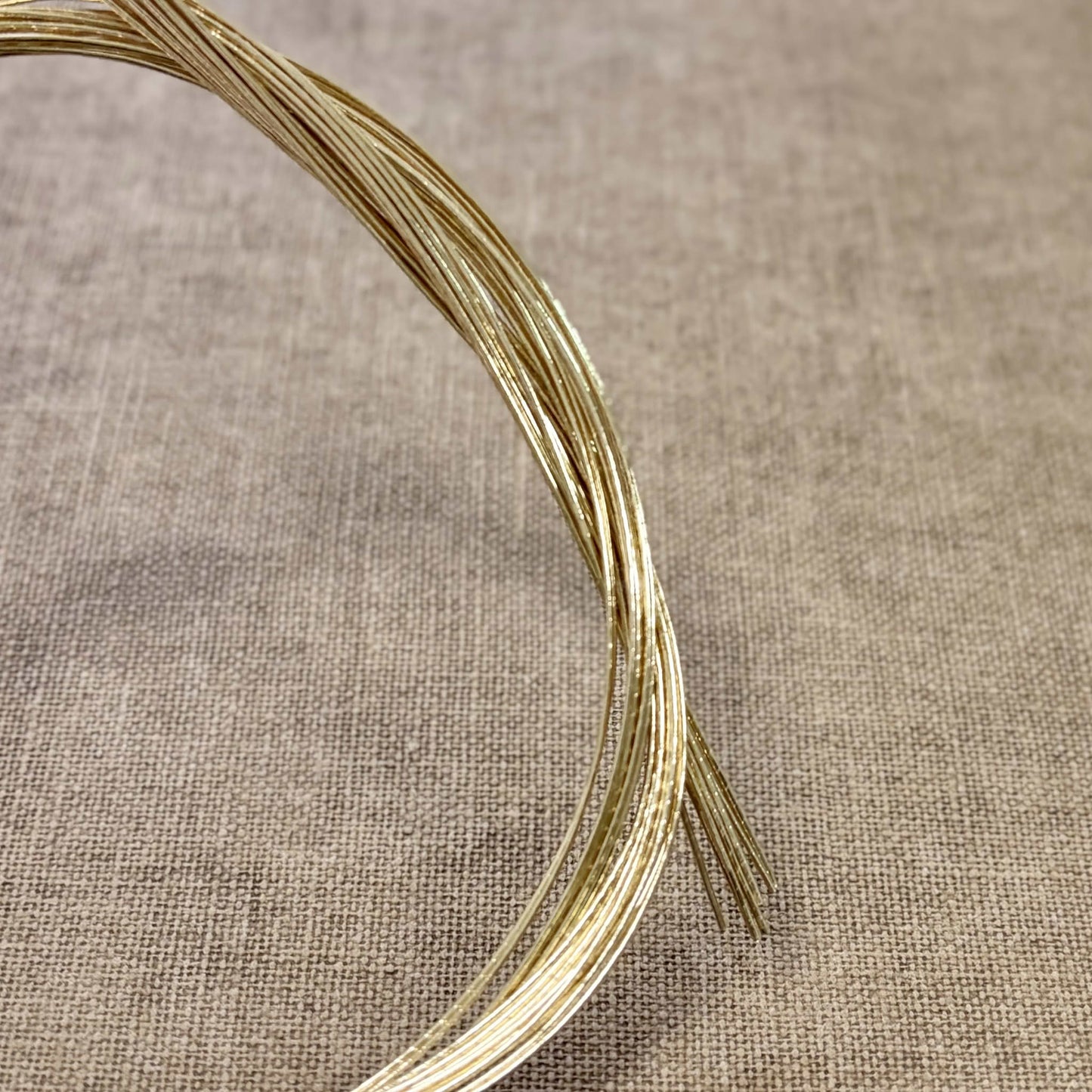Foil wrapped mizuhiki cord, champagne gold side detail view