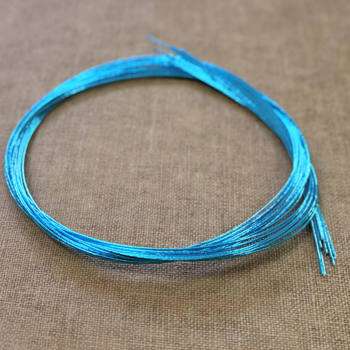 Foil wrapped mizuhiki cord, clear turquoise side detail view